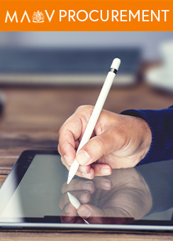 A photograph of a person's hand using a digital pen to write on a tablet device